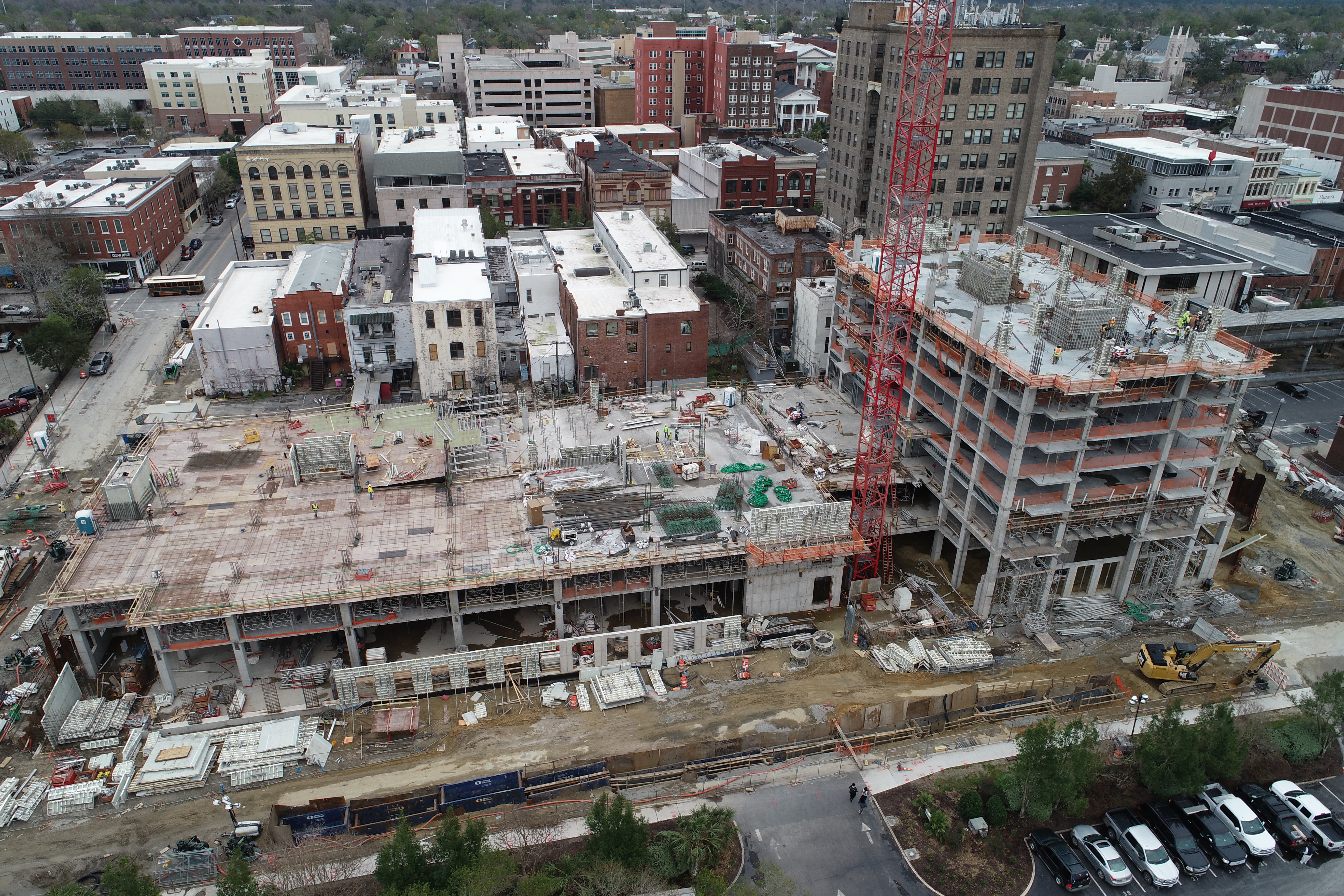 A series of buildings under construction in a metropolitan area.