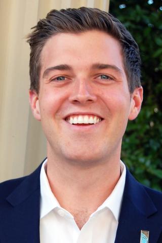 A headshot of Dylan Russell