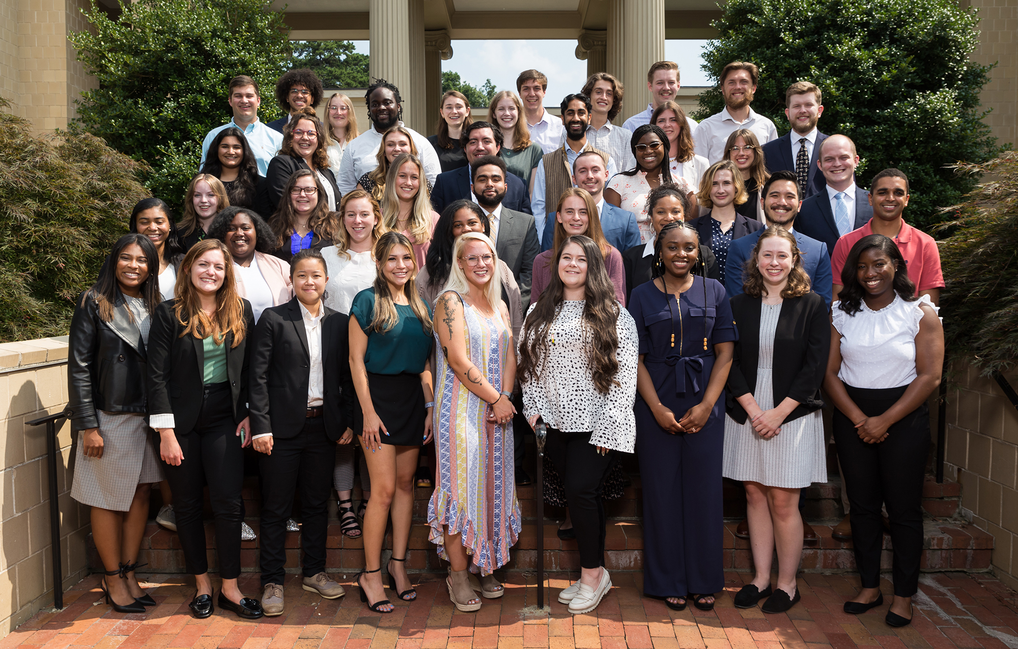 A group of 43 LFNC Fellows from cohorts one, two, and three on the front steps of the Knapp-Sanders Building on the UNC campus.