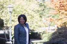 Anita Brown-Graham stands in front of fall foliage on campus at UNC-Chapel Hill in 2019.