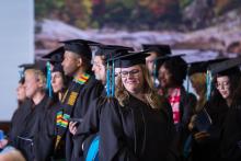 UNC MPA Graduates celebrate during Commencement ceremony in their regalia 