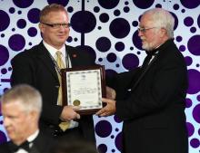  Kirk Boone accepts a Presidential Citation from IAAO