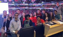 A group photo of the fellows at the Carolina Hurricanes hockey game