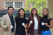 Students holding stickers that say "I heart good goverment." Students holding stickers that say "I heart good goverment."